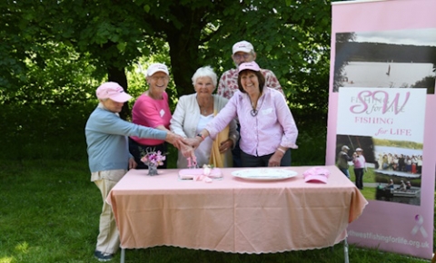 Cake cutting with special guest Dame Judi Dench and some of the trustees.